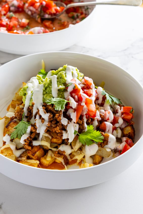 Ground beef taco bowls with crispy potatoes, pico de Gallo and guacamole.