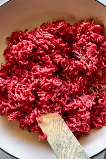 Raw beef in frying pan.