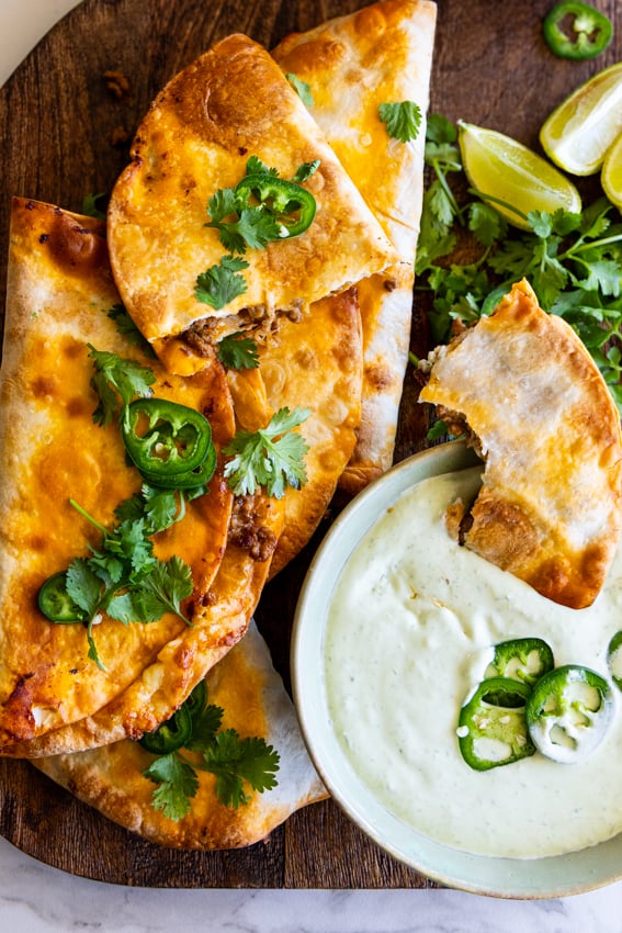 Baked Beef Tacos served with jalapeño crema.