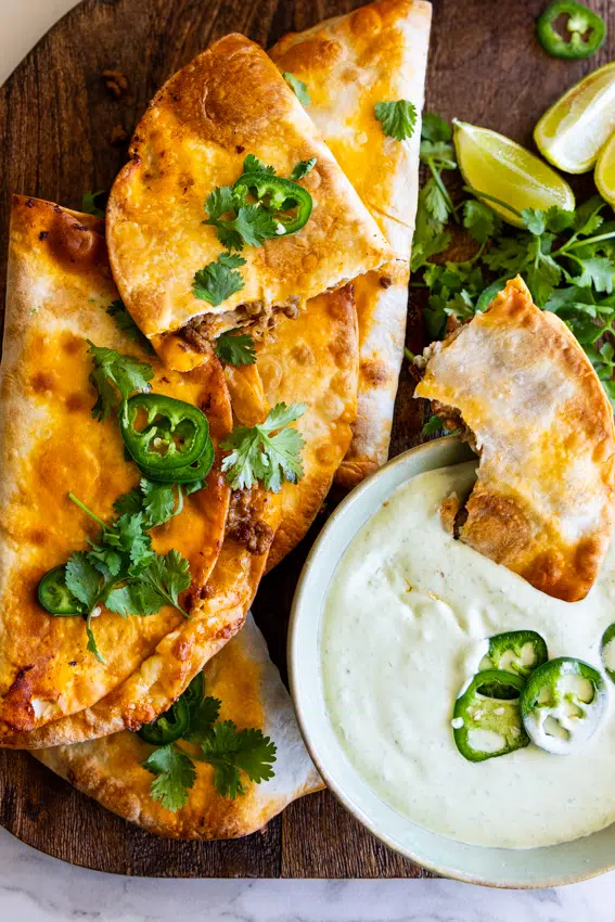 Baked Beef Tacos served with jalapeño crema.