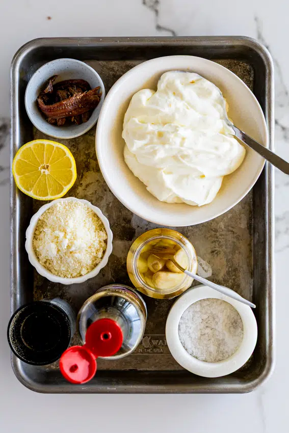 Ingredients for healthy Caesar dressing made with yogurt.
