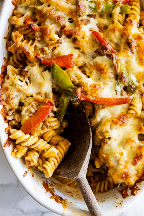 Taco pasta bake with peppers and onions.