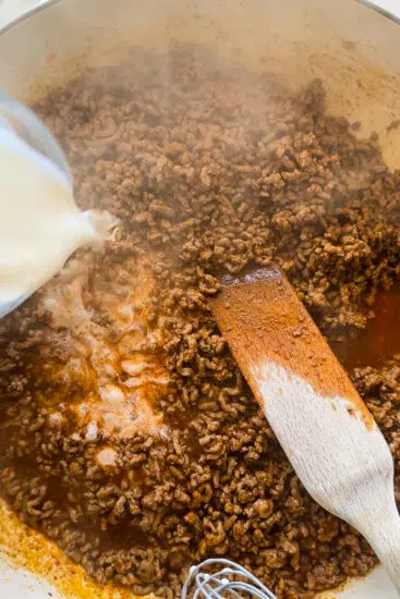 Cornstarch slurry poured into taco meat