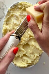 Parmesan cheese grated on cottage pie.