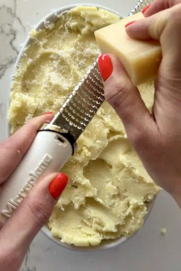 Parmesan cheese grated on cottage pie.