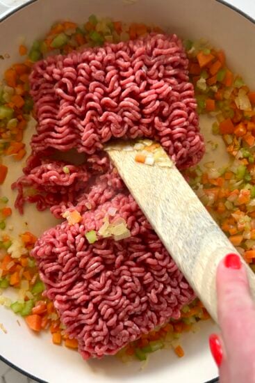 Ground beef browned in pan.