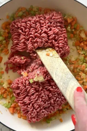 Ground beef browned in pan.