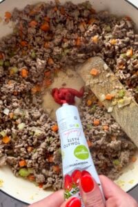 Tomato paste added to cottage pie filling.