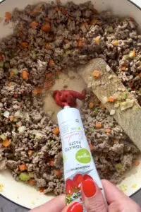 Tomato paste added to cottage pie filling.