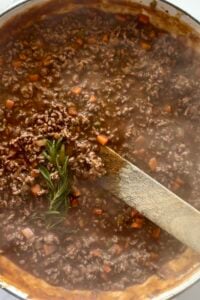 Cooked cottage pie filling.