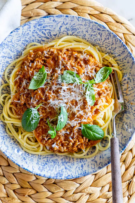 Creamy Tomato Beef Pasta with Parmesan cheese and fresh basil.