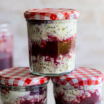 Overnight oats with berry sauce in jars.