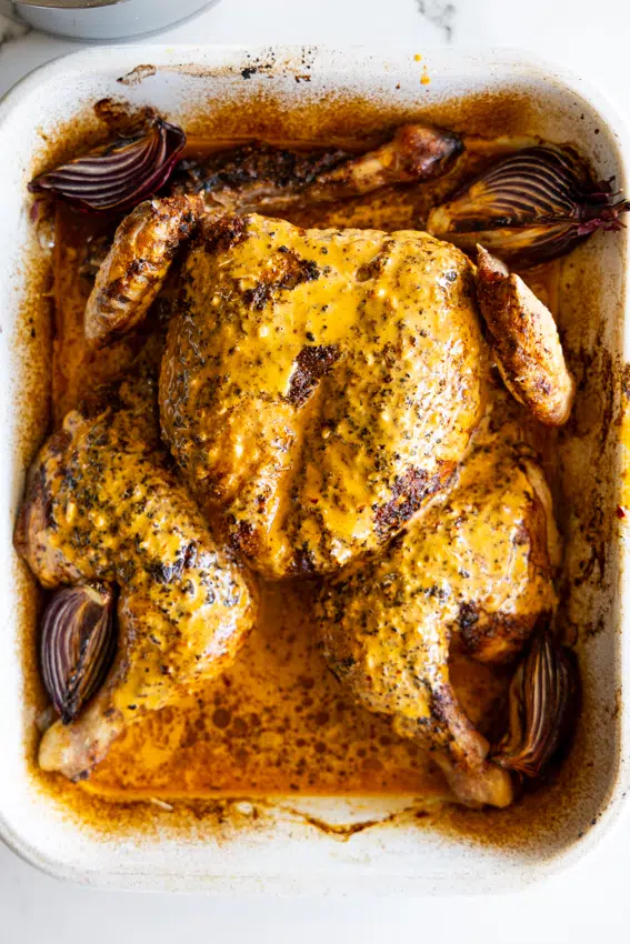 Spatchcock chicken drenched in creamy peri-peri sauce.