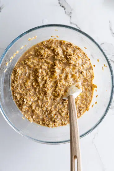 Baked oatmeal mixture in mixing bowl.