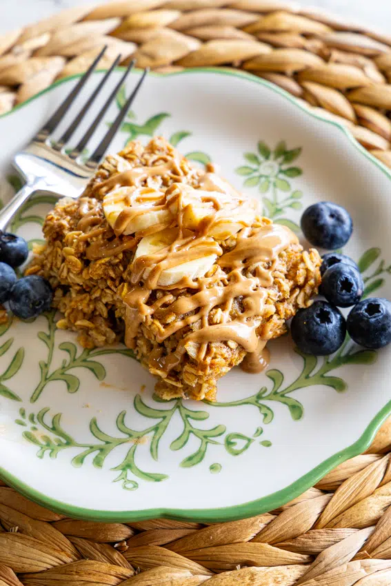 Easy baked oatmeal with bananas and blueberries on serving plate.