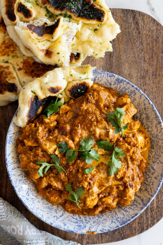 Garlic butter naan with butter chicken curry.