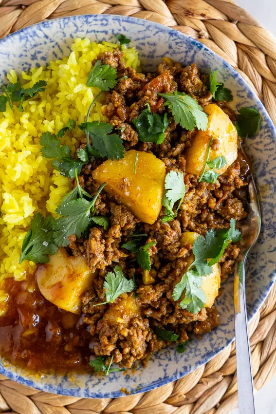 Ground beef curry with potatoes and turmeric rice.