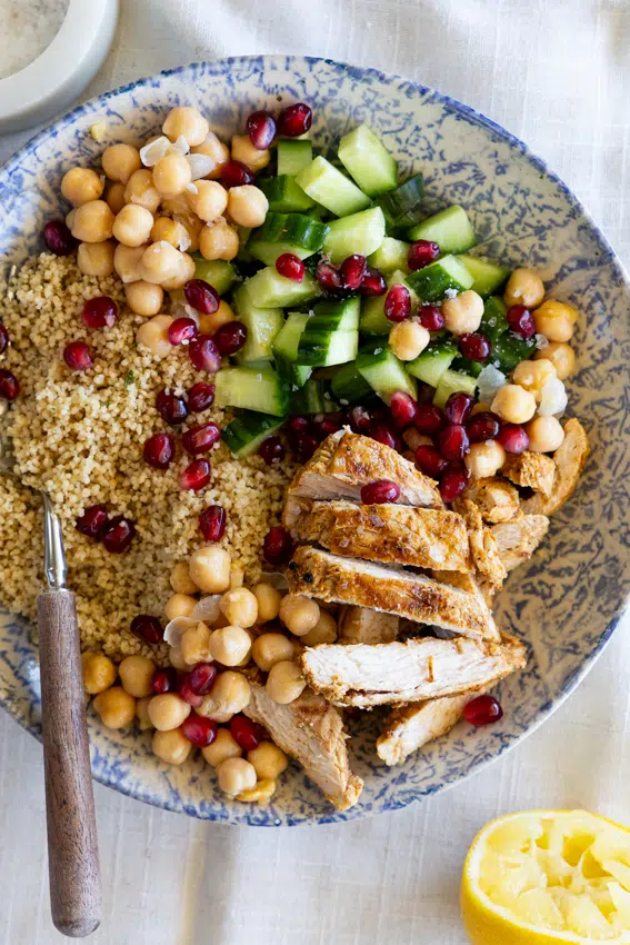Moroccan chicken couscous with cucumber and pomegranate.