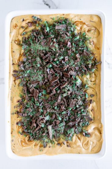 Peppermint Crisp Tart topped with chopped peppermint crisp chocolate.