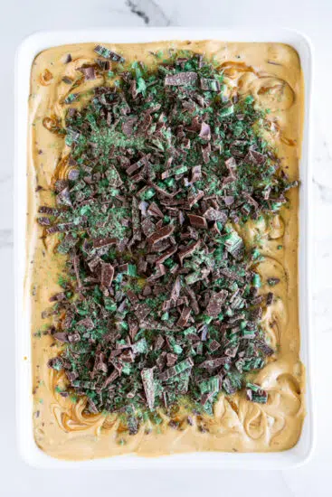 Peppermint Crisp Tart topped with chopped peppermint crisp chocolate.