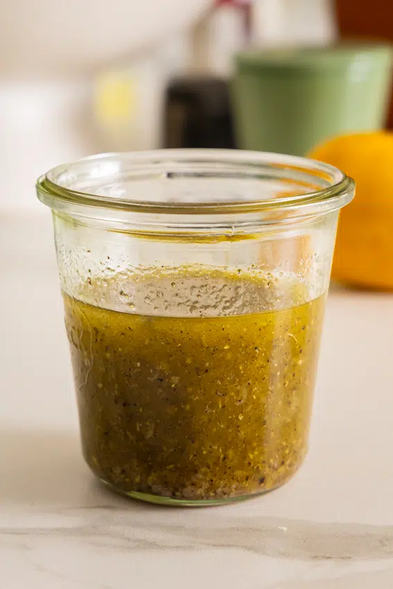 Greek Salad Dressing in glass jar.