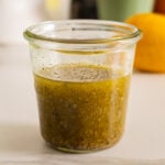 Homemade Greek Salad Dressing in a glass jar.