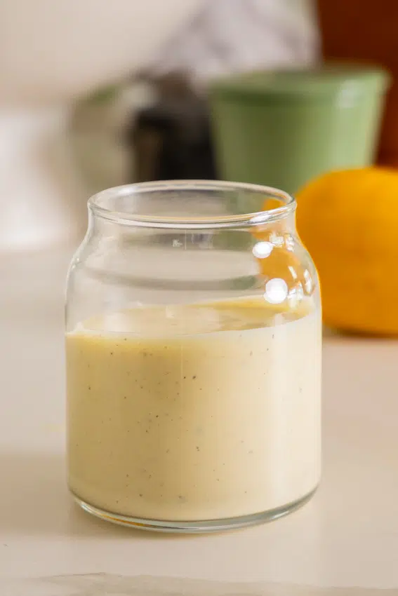 Homemade Caesar Dressing in glass bottle.