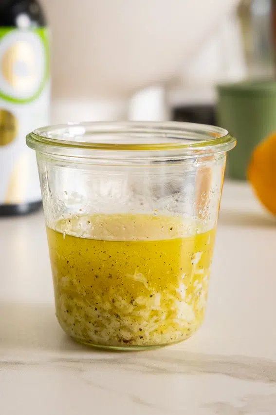 Lemon Parmesan Dressing in glass jar.